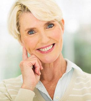 Smiling woman with short blonde hair